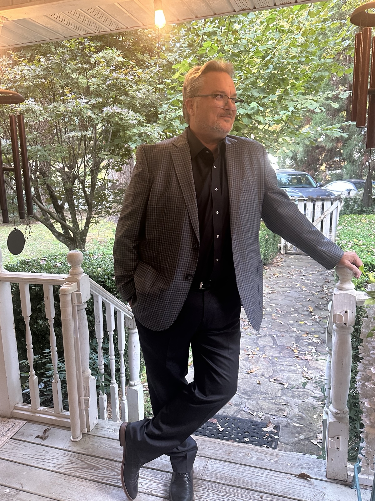 Daniel Shepherd, founder of In My Pocket Labs, standing on a porch